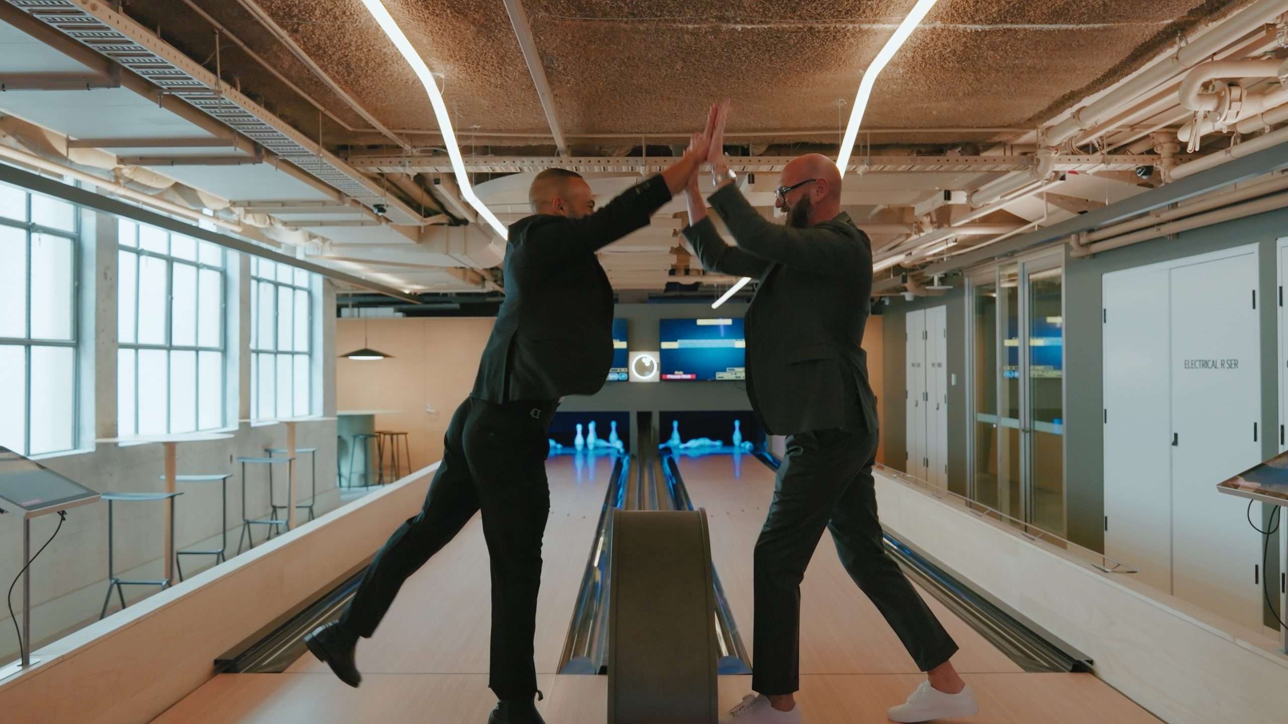 The doris directors high-fiving